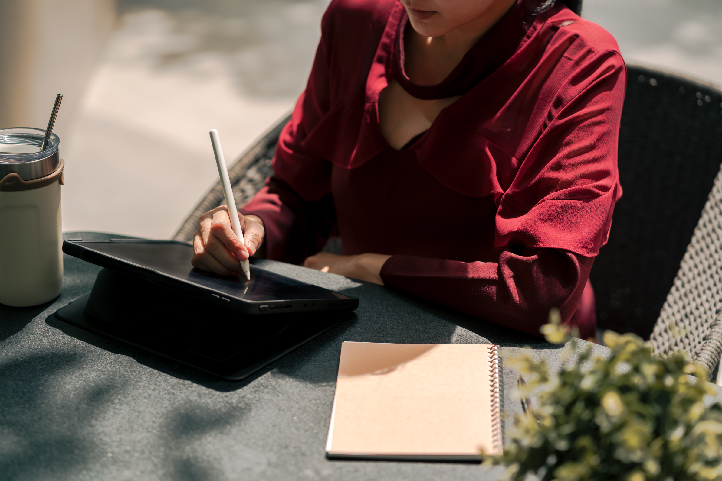Copywriter Woman writing on digital tablet